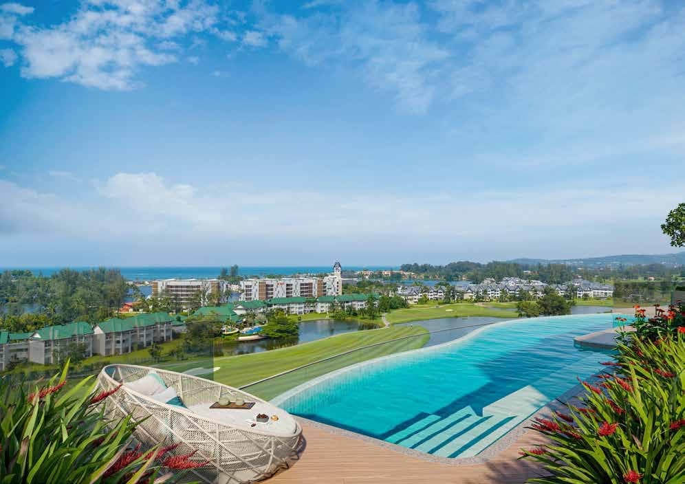 Rooftop pool with a daybed overlooking the golf course and lagoons