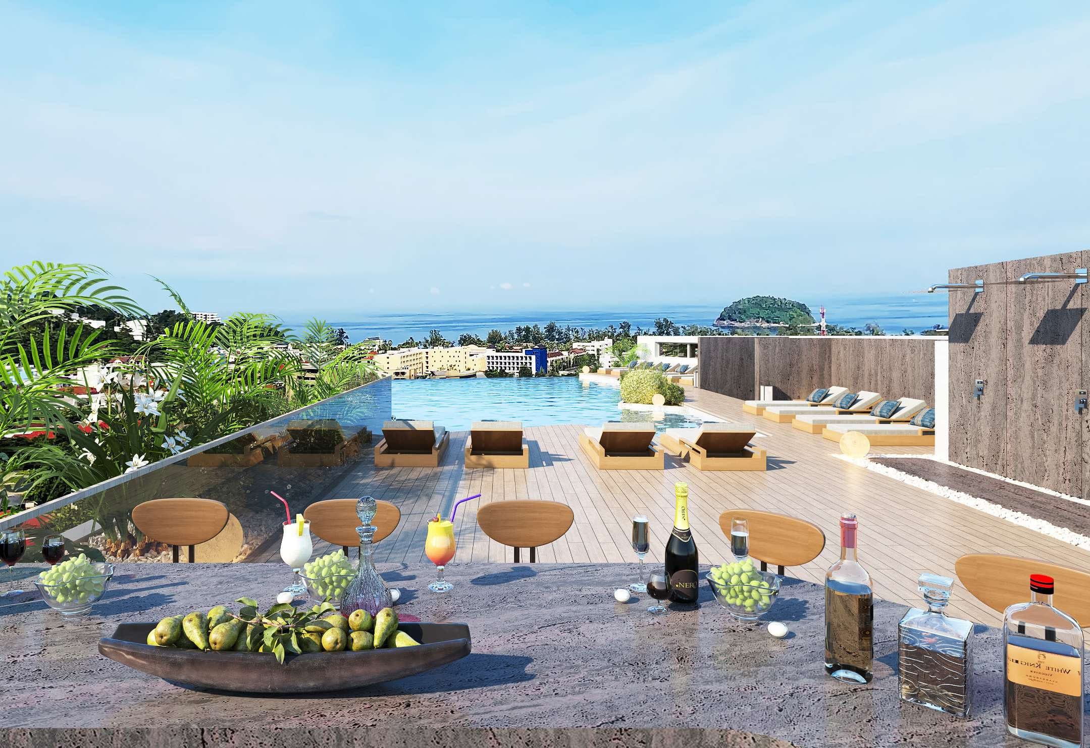 Rooftop bar overlooking the pool deck and sea