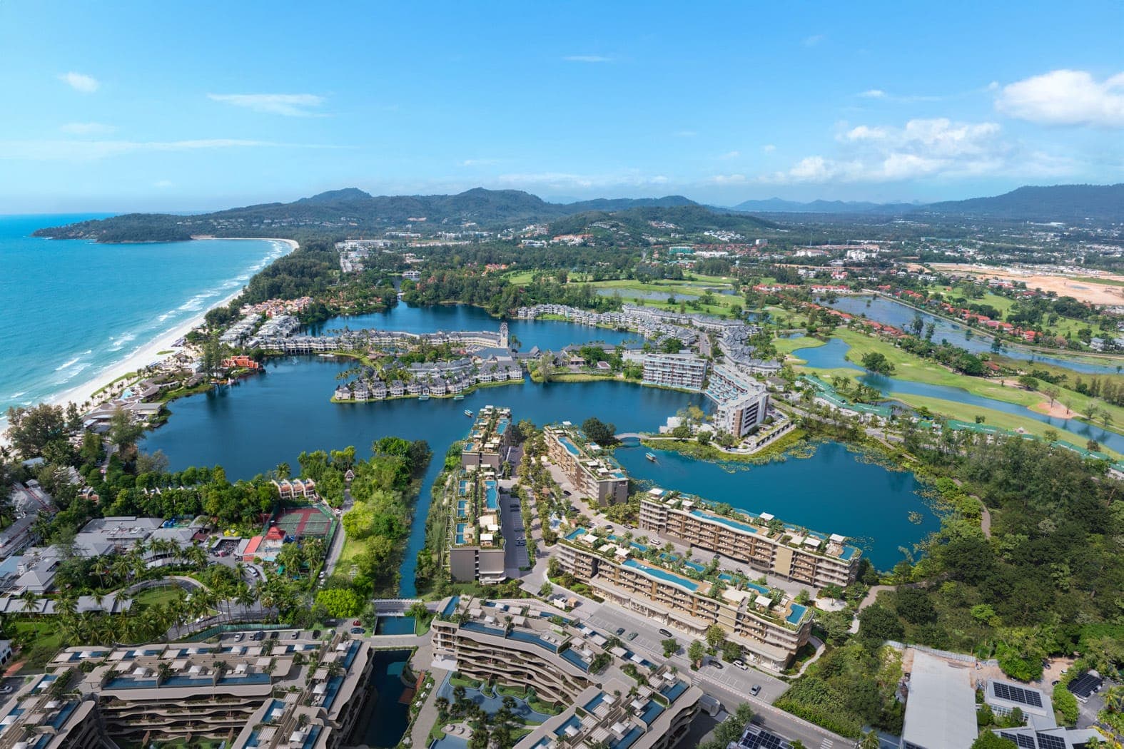 Aerial view of Laguna Phuket with the residences beside the lagoon and Bang Tao Beach