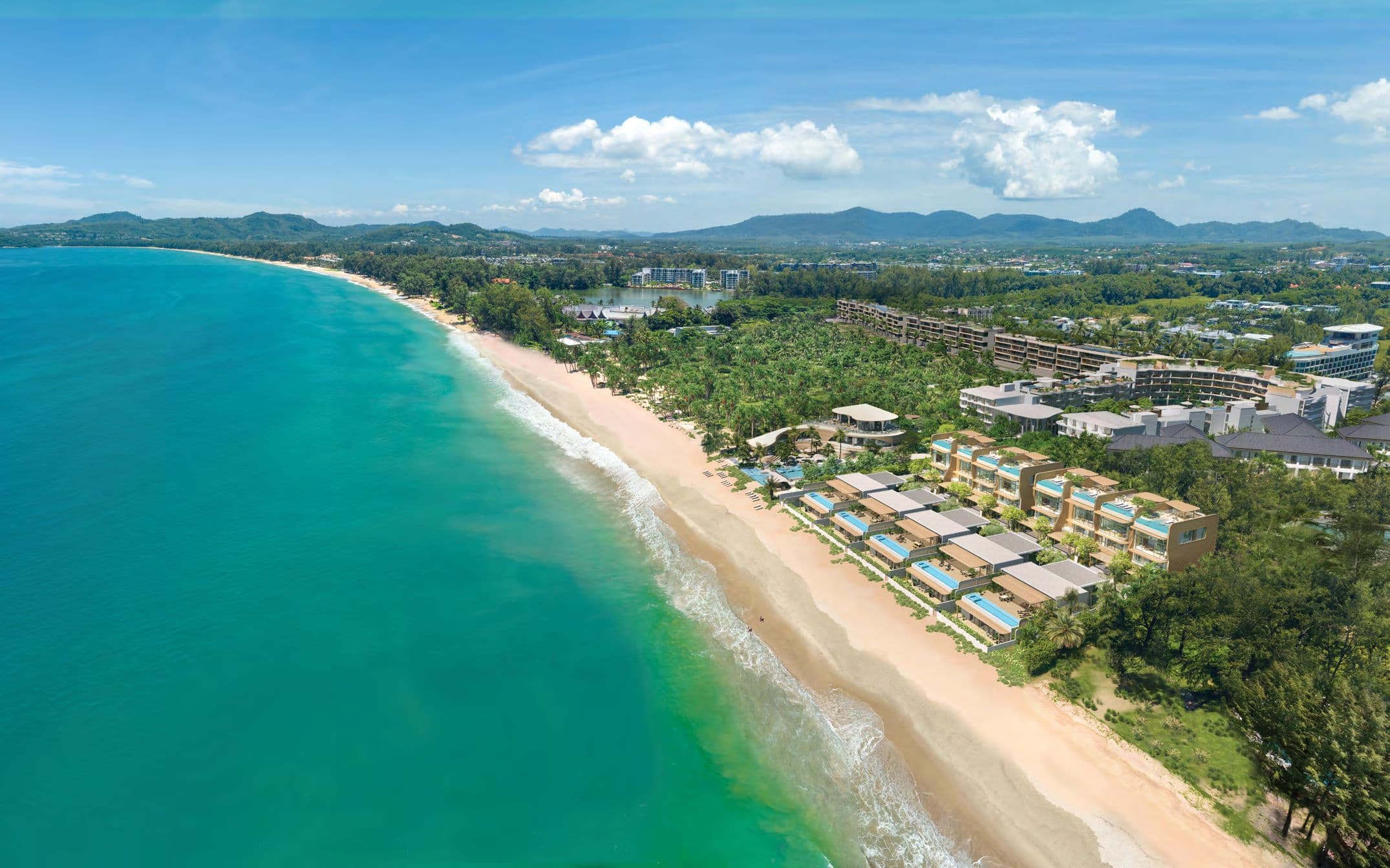 Aerial view of Bang Tao Beach and Laguna Phuket with the villas on the shore