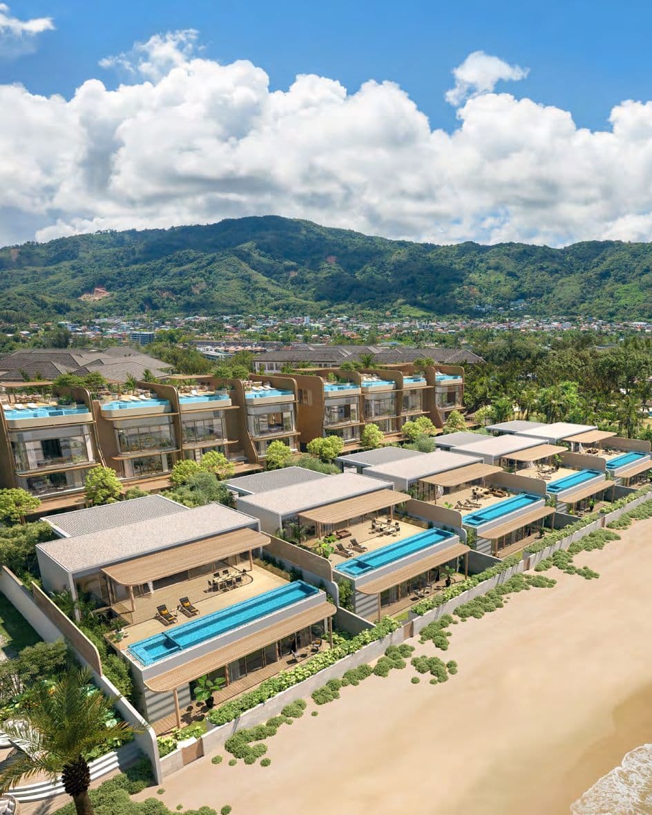 Beachfront villas with hills behind