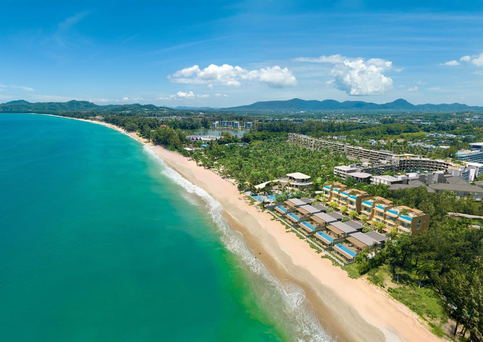 Aerial view of Bang Tao Beach and Laguna Phuket with the townhomes on the shore