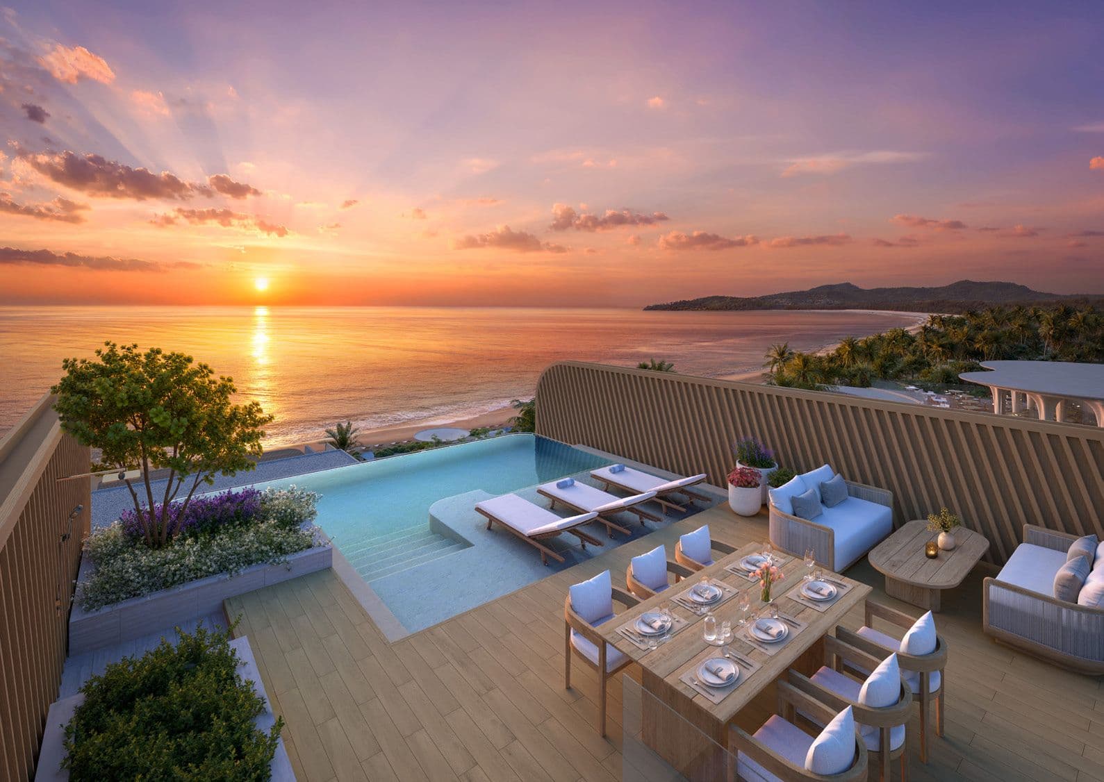 Private rooftop infinity pool and dining terrace at sunset over Bang Tao Beach
