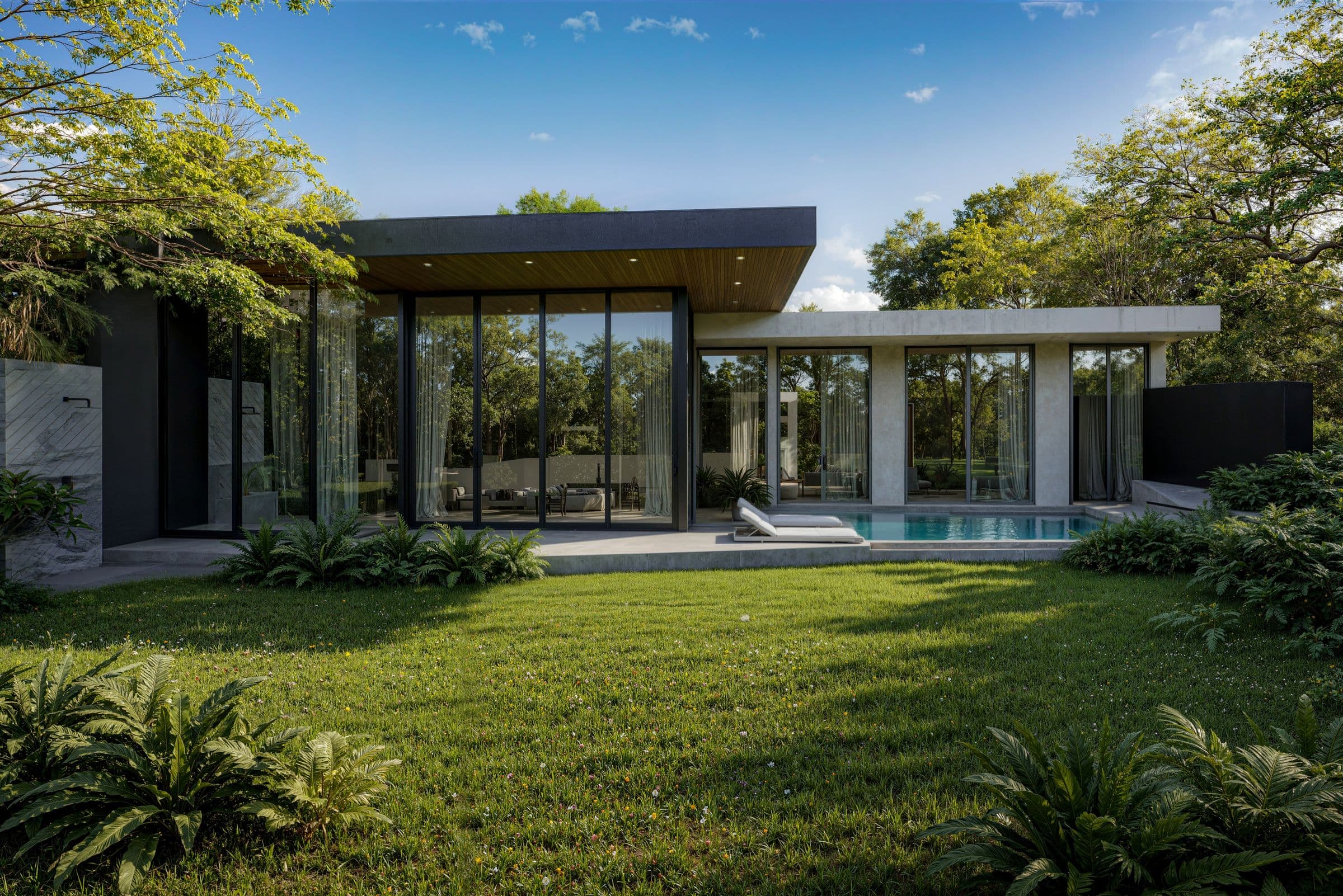 Villa and pool behind tropical planting