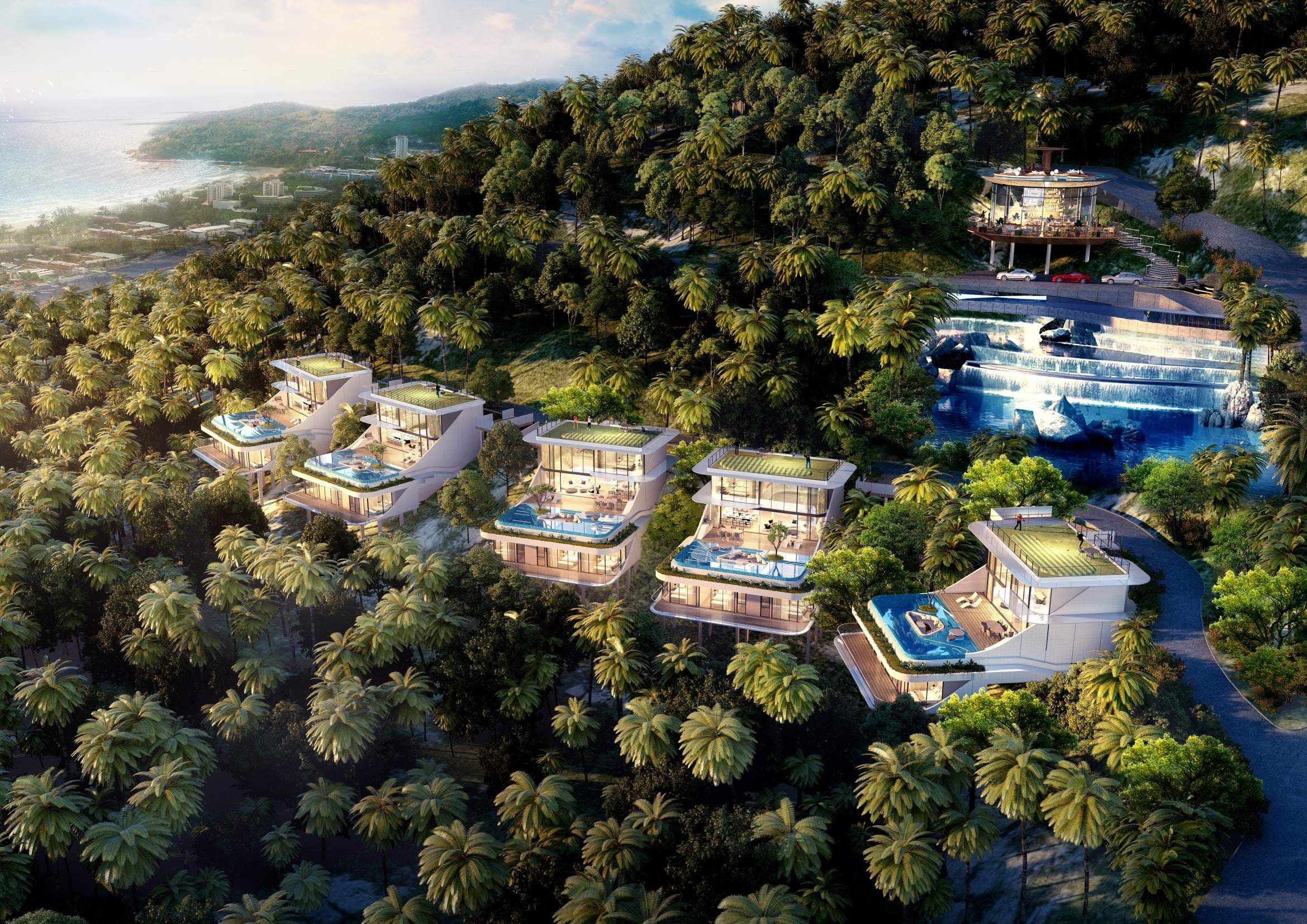 Aerial view of the villas on the wooded hillside with the sea beyond