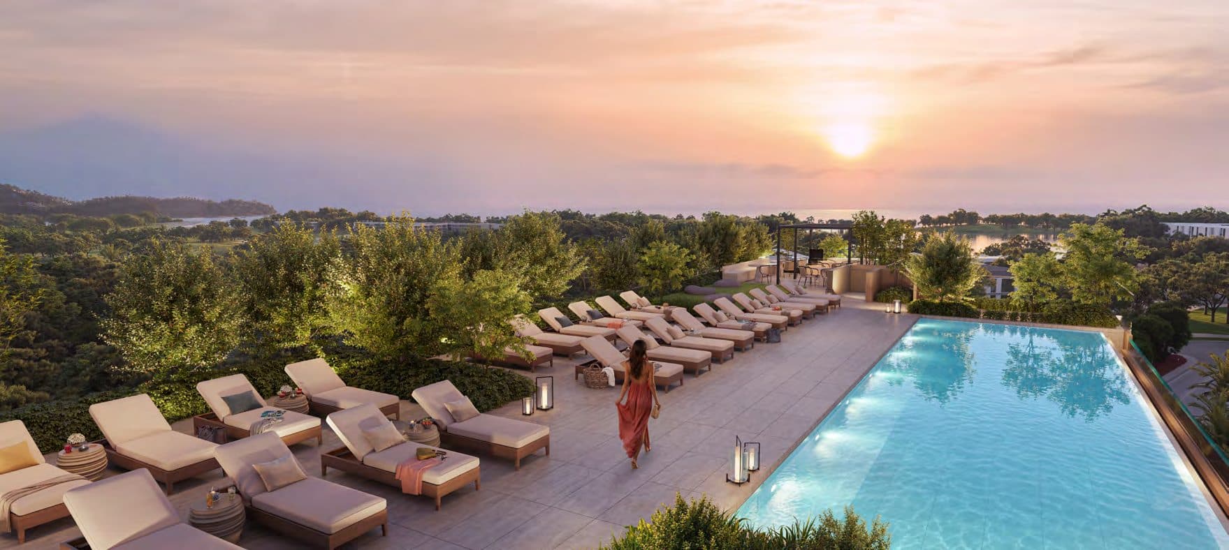 Rooftop pool and sun loungers at sunset above the gardens