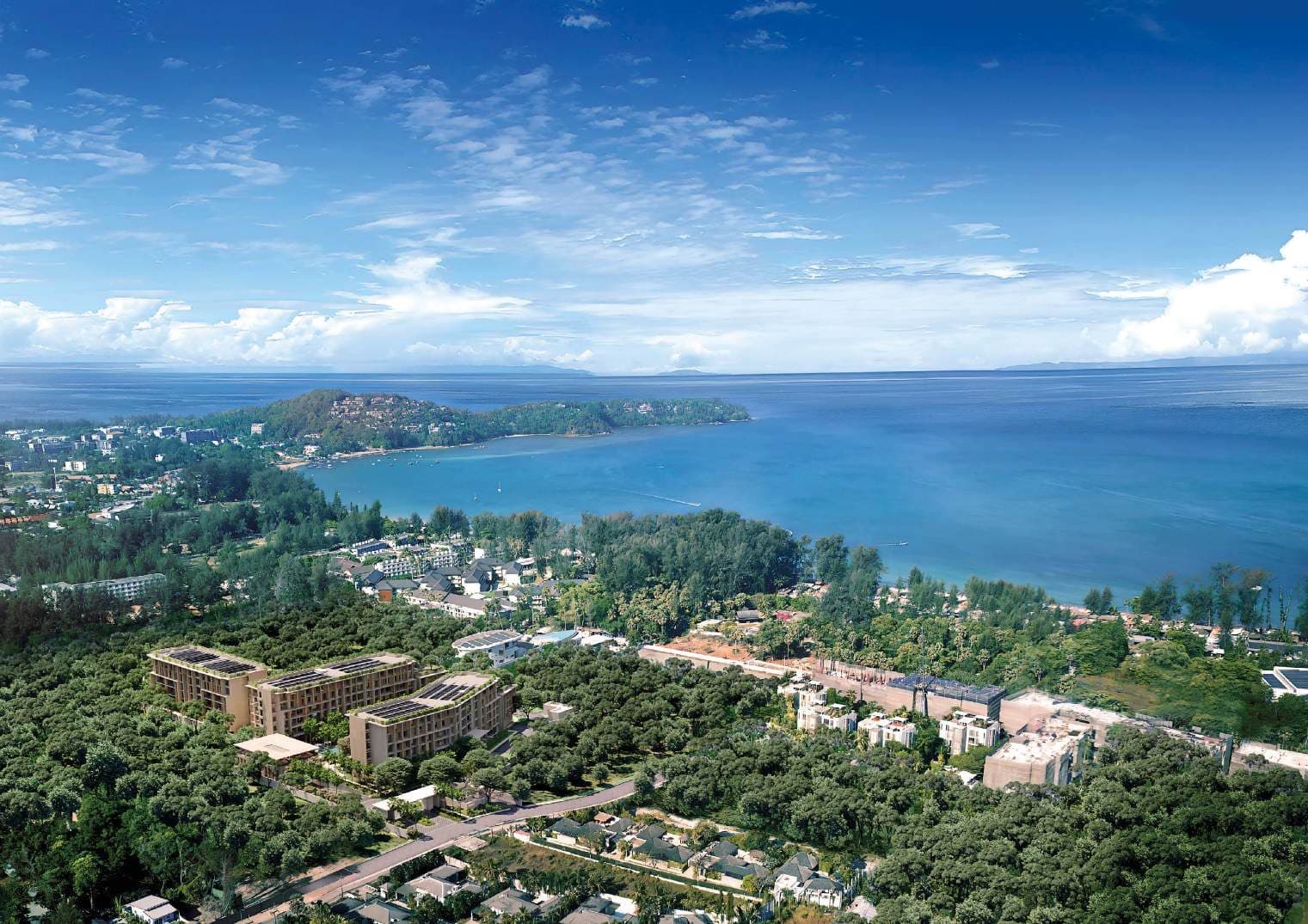 Aerial view of the three Sudara buildings with Bang Tao Bay beyond