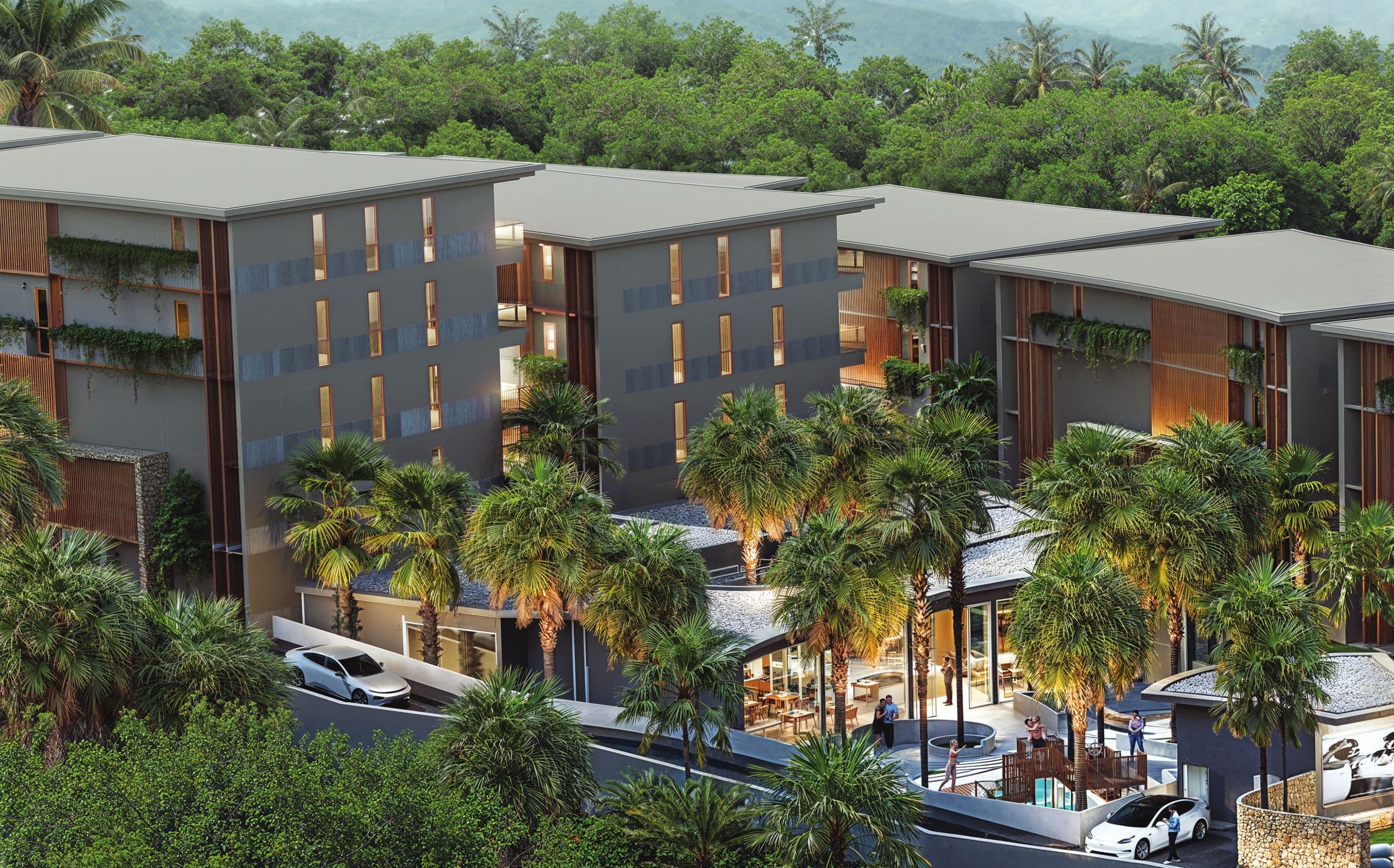 The Trees Residence buildings and café among palm trees