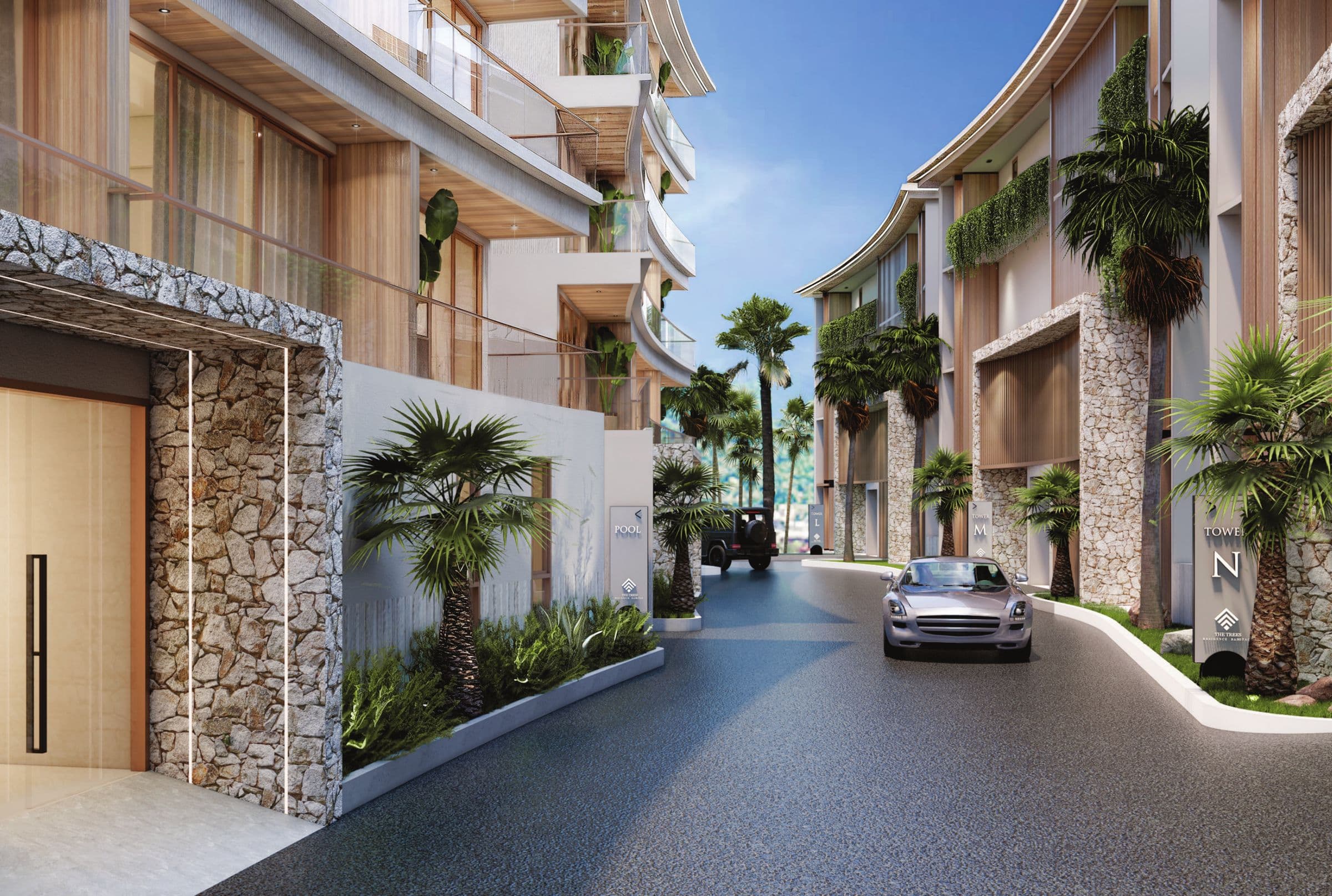 Entrance drive between stone-clad buildings