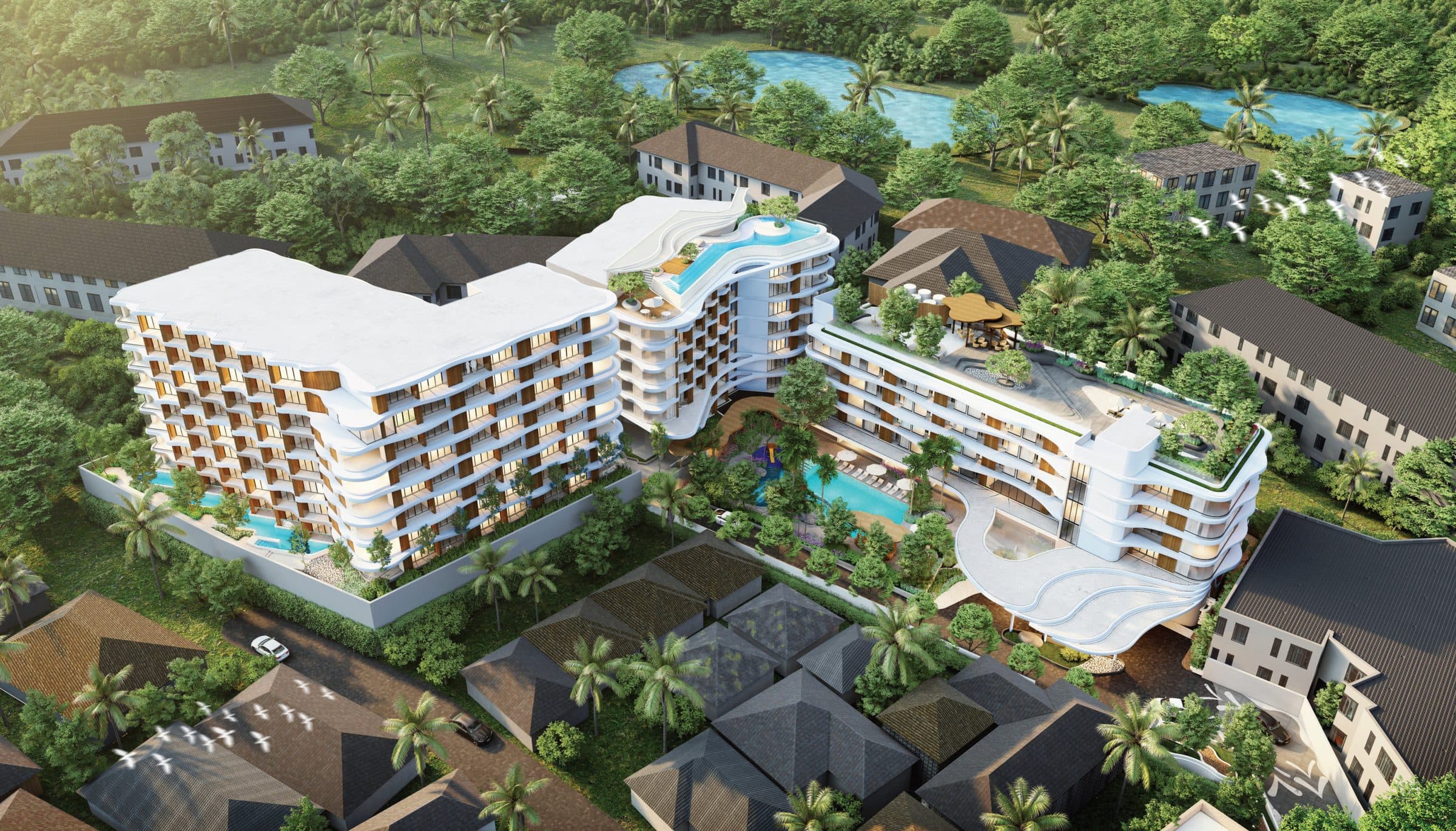 Aerial view of the three buildings and pools