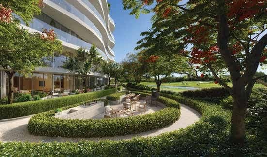 Landscaped garden seating area beside the residences