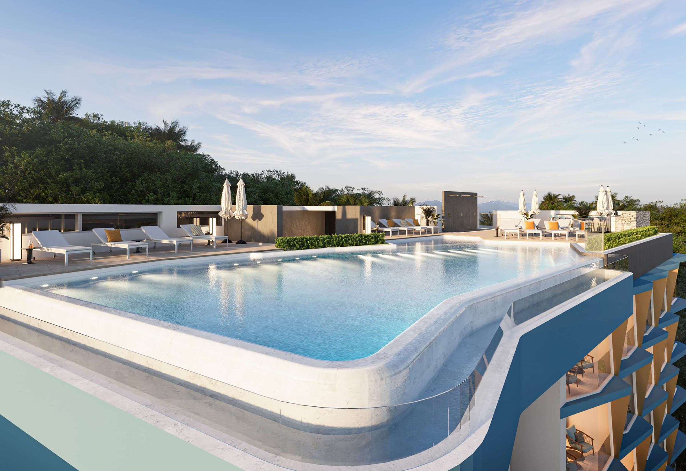 Ashiyana Heights rooftop infinity pool with loungers and hillside backdrop