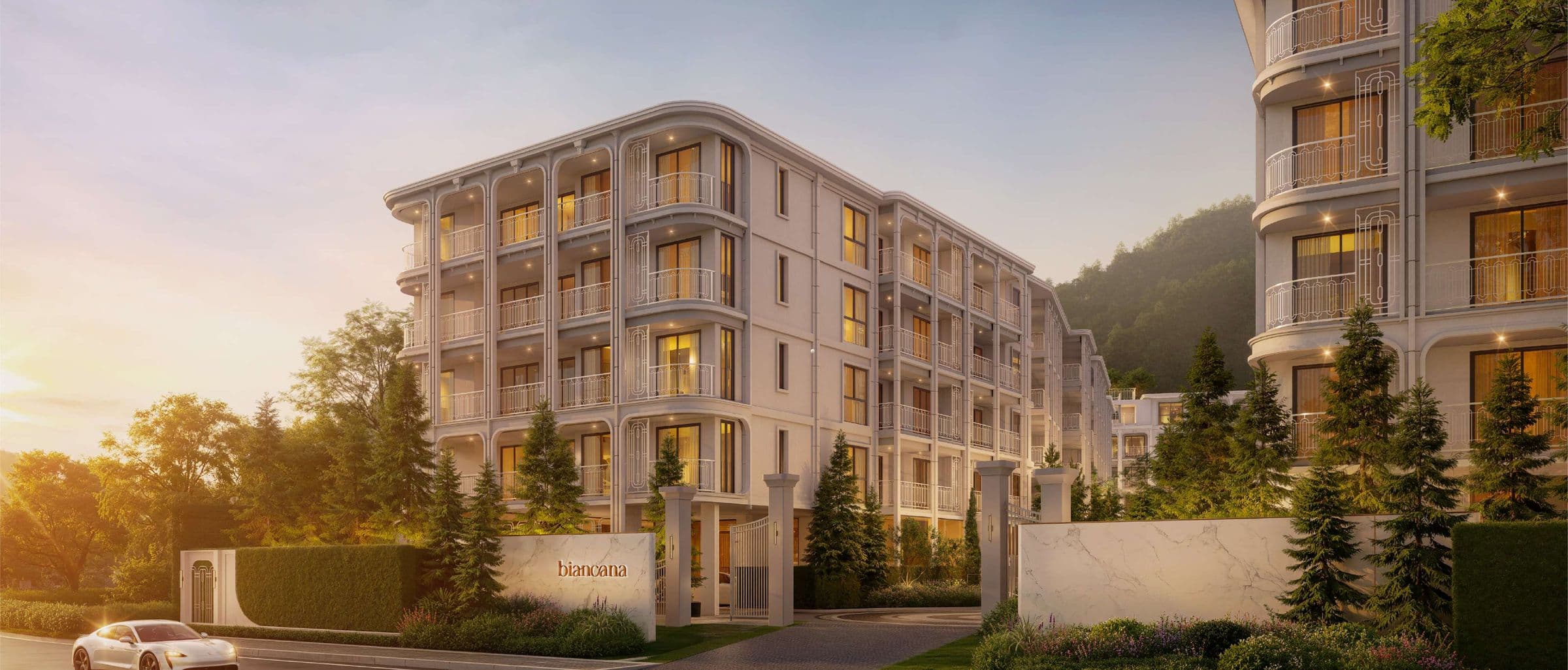 Biancana's five-storey Modern Classic buildings and entrance gates at sunset