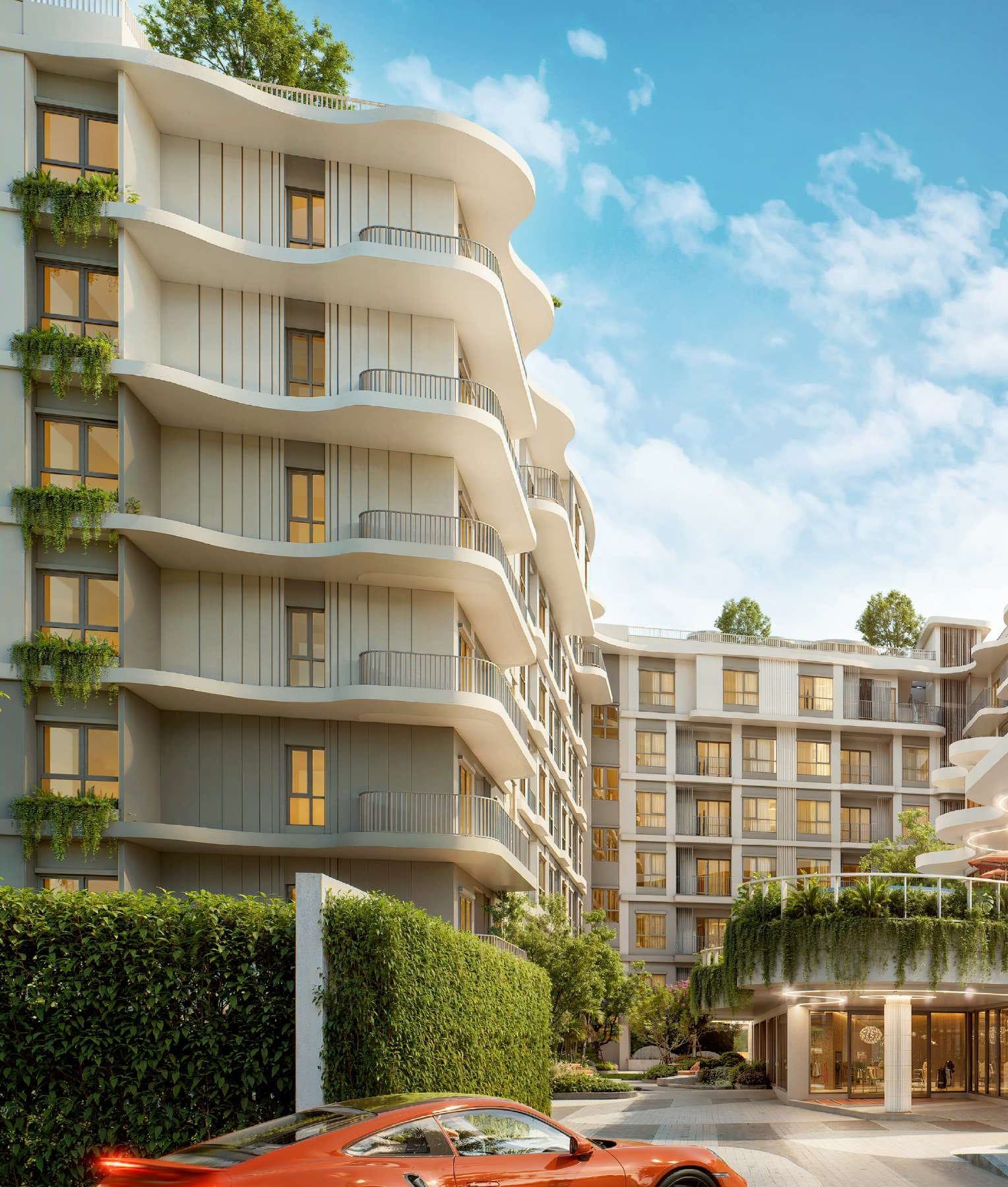 Curving white balconies of a new residence in Kata
