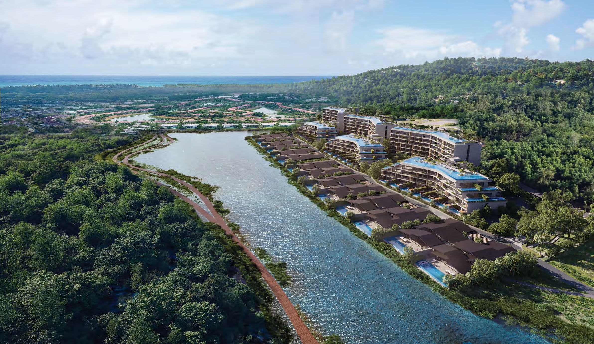 Aerial view of the residences along the lake, with a waterside trail and forest