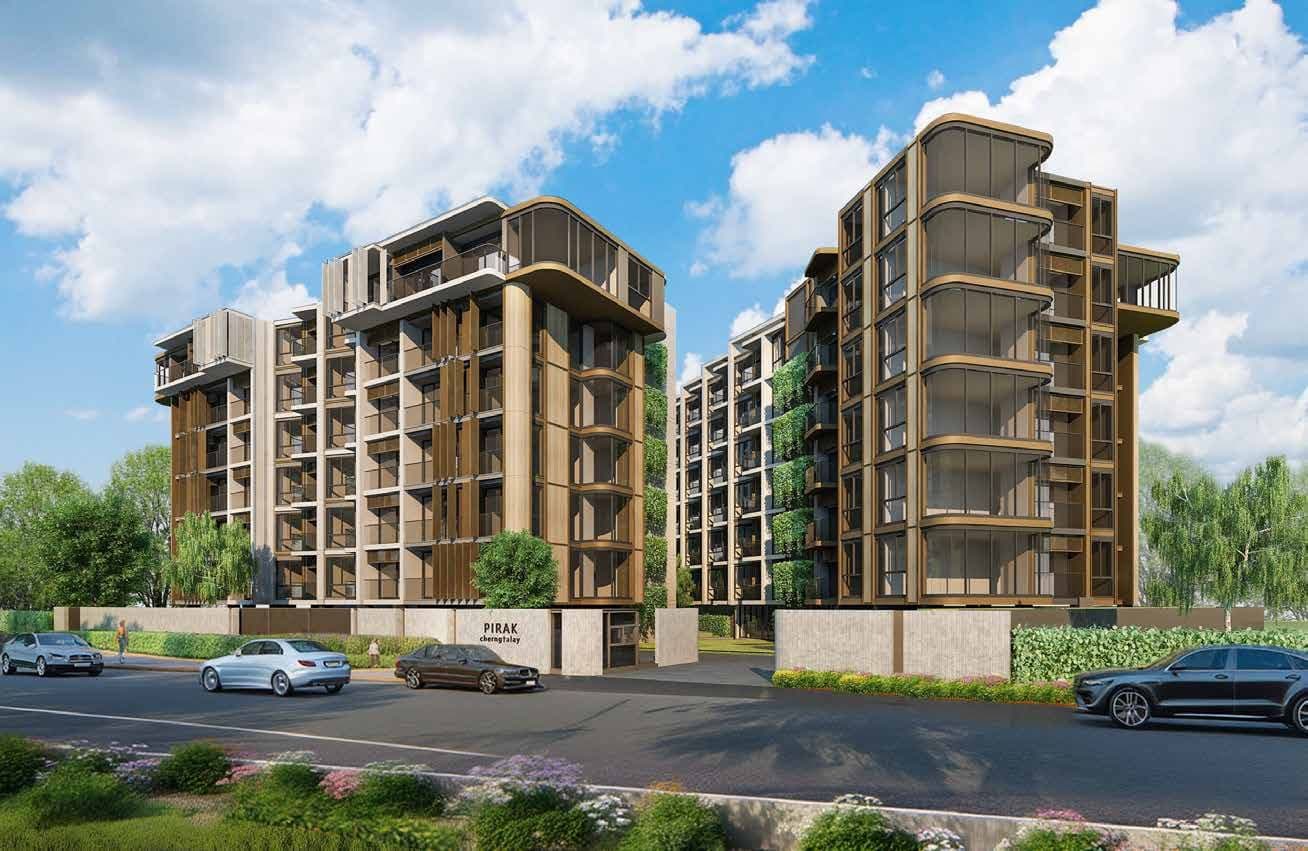 Pirak Condominium's two buildings with timber screens and green walls behind a landscaped frontage