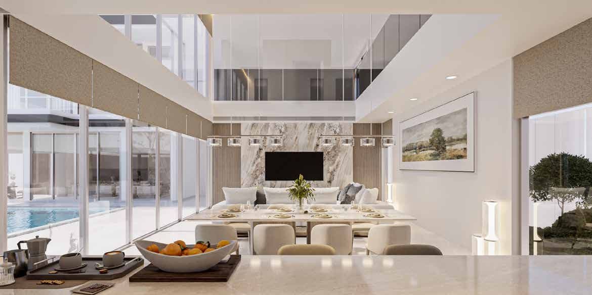 Double-height living and dining room with full-height glazing onto the pool