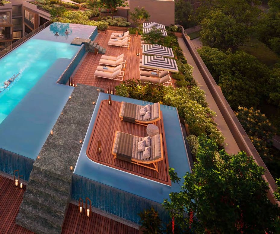 Rooftop infinity-edge pool and timber sun deck with loungers